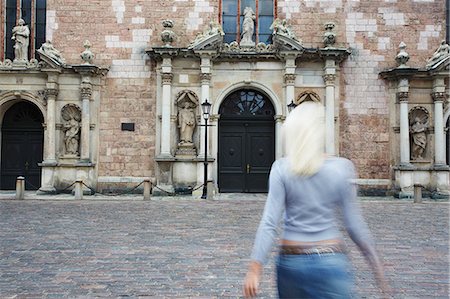 saint peter's church - Woman walking towards St Peter's, Riga, Latvi. Stock Photo - Rights-Managed, Code: 862-03712718