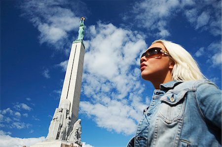 riga - Woman standing in front of Freedom Monument, Riga, Latvi. Stock Photo - Rights-Managed, Code: 862-03712712