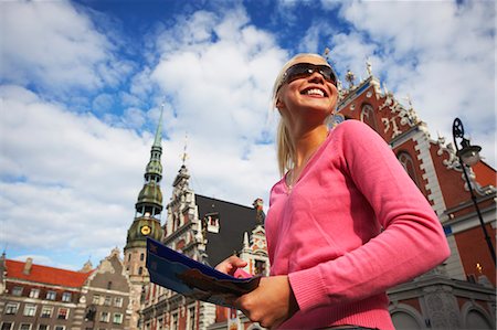 Woman standing outside House of Blackheads in Town Hall Square (Ratslaukums), Riga, Latvi. Stock Photo - Rights-Managed, Code: 862-03712721