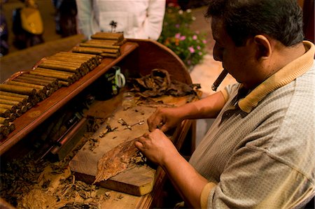 Playa del Carmen, Mexico. Making cigars at a cigar shop in Play del Carmen mexico Stock Photo - Rights-Managed, Code: 862-03712914