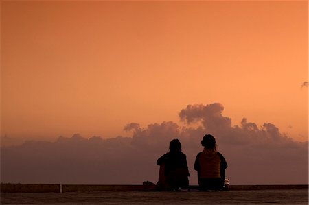 Playa del Carmen, Mexico. Watching the sun rise on the cruise ship dock in Playa del Carmen Mexico Stock Photo - Rights-Managed, Code: 862-03712929