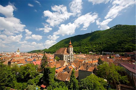 simsearch:862-03360982,k - Romania, Transylvania, Brasov. Rooftops of the old centre of Brasov, surrounded by woodlands. Stock Photo - Rights-Managed, Code: 862-03713153