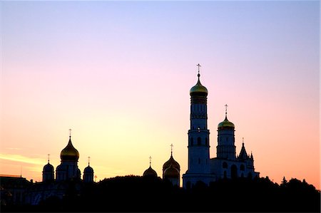 Russia, Moscow; Behind the Kremlin wall the Ivan the Great Bell, the bell towers from the Archangel Cathedral Stock Photo - Rights-Managed, Code: 862-03713289