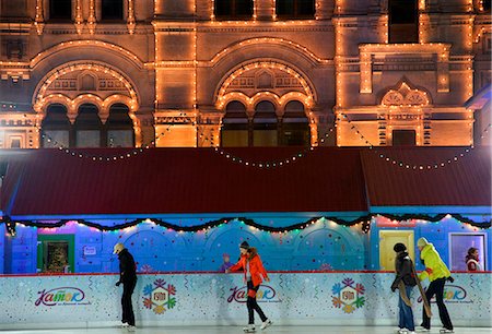 russia tourist attraction - Russia, Moscow; Youths ice-skating in front of the huge Shopping Mall, the Gum, on Red Square in winter Stock Photo - Rights-Managed, Code: 862-03713291