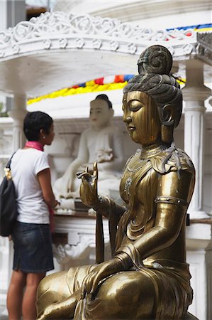 simsearch:862-03713574,k - Woman visiting Gangaramaya temple, Cinnamon Gardens, Colombo, Sri Lank. Stock Photo - Rights-Managed, Code: 862-03713580