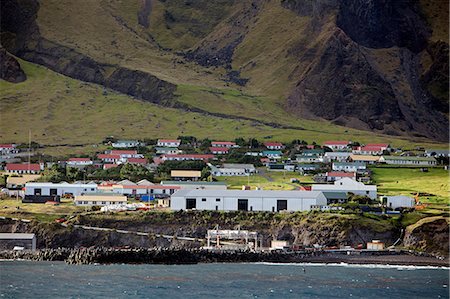 Tristan Da Cunha Island, settlement capital of Edinburgh  from the sea dominated by the foothills of the Queen Mary Volano. Stock Photo - Rights-Managed, Code: 862-03713742