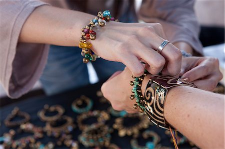 A western tourist buying jewelry in a market in Bangkok Thailand Stock Photo - Rights-Managed, Code: 862-03713775