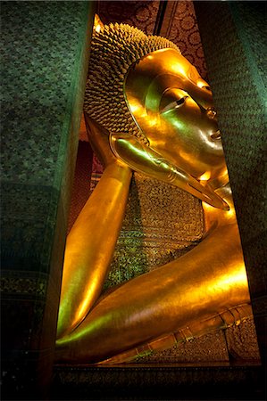 simsearch:862-03713799,k - Bangkok, Thailand. The reclining Buddha in Wat Pho. 46 m long and 15 m high gilded Stock Photo - Rights-Managed, Code: 862-03713829