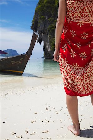 railay - Woman wearing sarong on Hat Tham Phra Nang beach, Railay, Krabi Province, Thailan. Stock Photo - Rights-Managed, Code: 862-03713871