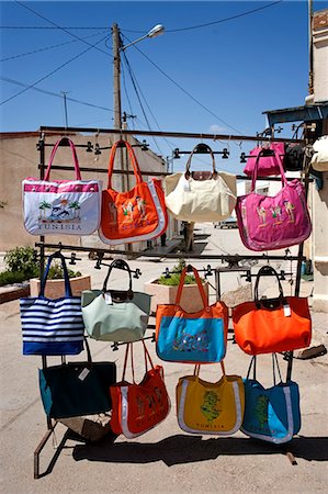 souvenir stall - Tunisia, El Jem. A tourist stall outside the coliseum of El Jem. Stock Photo - Rights-Managed, Code: 862-03713901