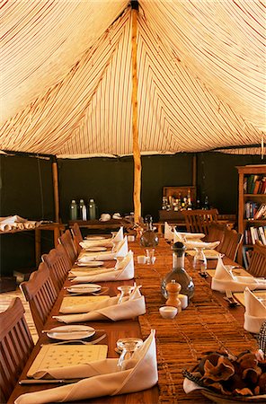 safari lodges - Tanzania, Katavi National Park.  The mess tent at Chada Camp laid for lunch. Stock Photo - Rights-Managed, Code: 862-03713912