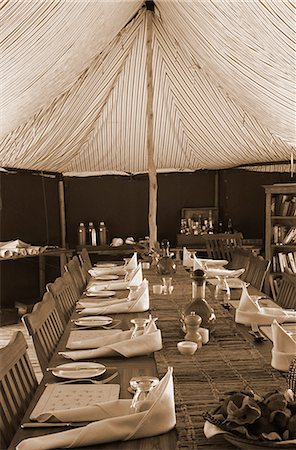 safari lodges - Tanzania, Katavi National Park.  The mess tent at Chada Camp laid for lunch. Stock Photo - Rights-Managed, Code: 862-03713913