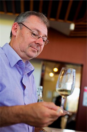 single man drinking wine - Australia, South Australia, Barossa Valley.  A man tasting wine on a winery tour of the Barossa Valley. Stock Photo - Rights-Managed, Code: 862-03736246