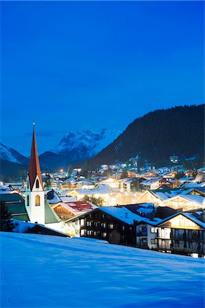 snowy night at home - Austria, The Tyrol, Seefeld, Seefeld Church Stock Photo - Rights-Managed, Code: 862-03736340