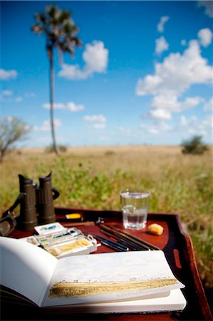 sketch pad - Botswana, Makgadikgadi, Jack's Camp. A still-life of an artists' tools, overlooking the Makgadikgadi plains. Stock Photo - Rights-Managed, Code: 862-03736367