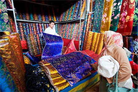 sunday market - China, Xinjiang Province, Kashgar, silk stands, Sunday Market Stock Photo - Rights-Managed, Code: 862-03736440