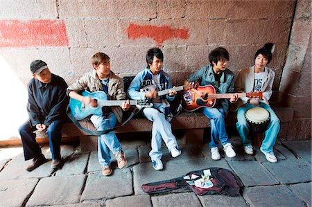 street entertainer - China, Hunan Province, Fenghuang, a group of boys singing and playing guitar Stock Photo - Rights-Managed, Code: 862-03736454