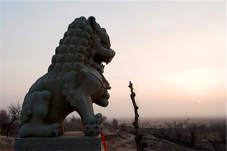 province china - China, Ningxia Province, Baishikou near Yinchuan, lion statue at sunrise Stock Photo - Rights-Managed, Code: 862-03736509