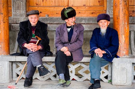 China, Guizhou Province, Taijiang, old men sitting down Foto de stock - Con derechos protegidos, Código: 862-03736554