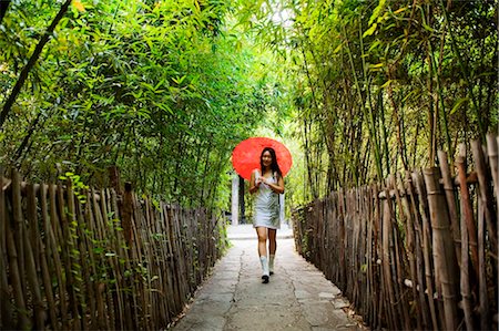 simsearch:862-03736484,k - China, Beijing, Ethnic Minorities Park, a girl with parasol walking through a bamboo grove Stock Photo - Rights-Managed, Code: 862-03736603