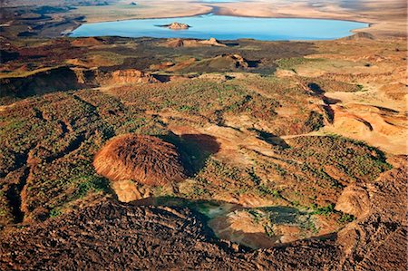 Volcanic craters and lava dotting the volcanic ridge, known as The Barrier, that divided Lake Turkana and the Suguta Valley. Stock Photo - Rights-Managed, Code: 862-03736862