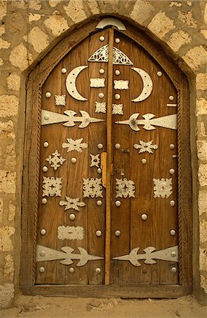 entranced - Mali, Timbuktu or Tombouctou. The decorative doorway of the 15th-century Sidi Yahya, or Sidi Yehia, Mosque Stock Photo - Rights-Managed, Code: 862-03736929