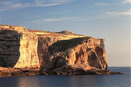simsearch:400-08695427,k - Malta, Gozo, Saint Lawrence, Dwerja, Sunset at the cliffs of Dwerja with Fungus Rock in the foreground. Foto de stock - Con derechos protegidos, Código: 862-03736950