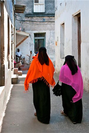 Tanzania, Zanzibar, Stone Town. A typical scene in one of Stone Town s maze of narrow streets. Stock Photo - Rights-Managed, Code: 862-03737267