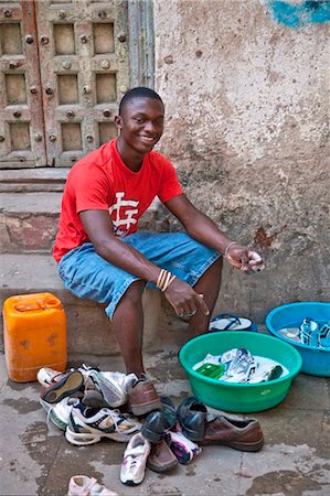 Tanzania, Zanzibar, Stone Town. A typical everyday scene in one of Stone Town s maze of narrow streets. Stock Photo - Rights-Managed, Code: 862-03737268