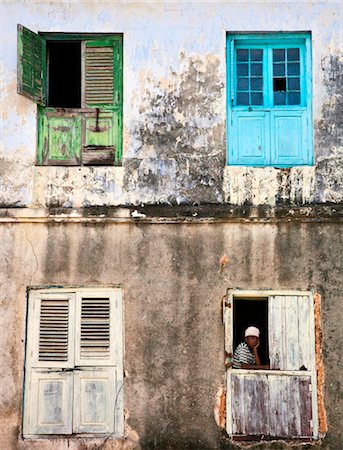 simsearch:862-03737305,k - Tanzania, Zanzibar, Stone Town. The shuttered windows of an old building in Stone Town. Stock Photo - Rights-Managed, Code: 862-03737263