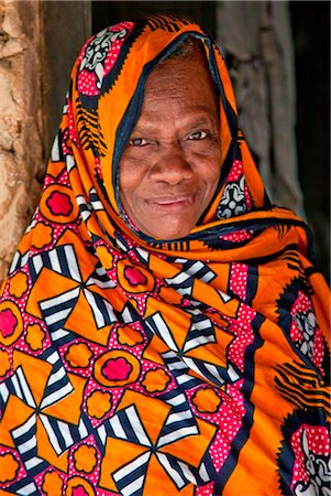 Tanzania, Zanzibar. An old woman at the front door of her home near Mangapwani. Stock Photo - Rights-Managed, Code: 862-03737290