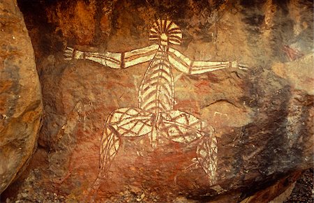 Australia, Northern Territory, Kakadu NP. The Anbangbang Shelter at Nourlangie Rock, a fearsome spirit painted by Nayombolmi. Stock Photo - Rights-Managed, Code: 862-03730944
