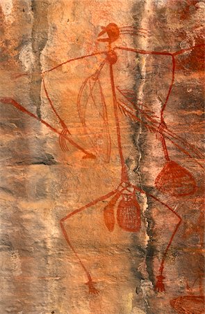 parc national de kakadu - Australie, Northern Territory, Parc National de Kakadu. Une autochtone peints ressemblant à bâton figure humaine avec l'équipement de chasse à Ubirr. Photographie de stock - Rights-Managed, Code: 862-03730948