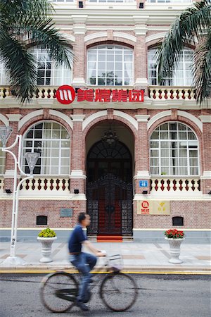 simsearch:695-03381970,k - Man cycling past renovated colonial building, Shamian Island, Guangzhou, Guangdong Province, China Stock Photo - Rights-Managed, Code: 862-03731050