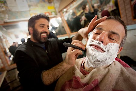 Having a shave at the local barber in Gulmarg, Kashmir, India Stock Photo - Rights-Managed, Code: 862-03731292