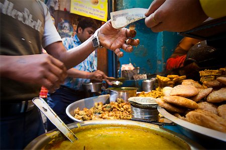 paying for purchase - A food stall in Old Delhi, India Stock Photo - Rights-Managed, Code: 862-03731322