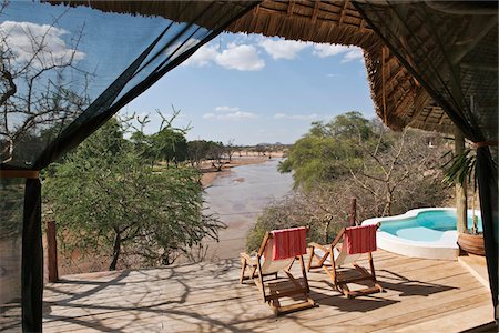 simsearch:862-05998435,k - Kenya, the sun deck and pool of a bedroom in the luxurious Sasaab Lodge situated on the banks of the Uaso Nyiru River Stock Photo - Rights-Managed, Code: 862-03731470