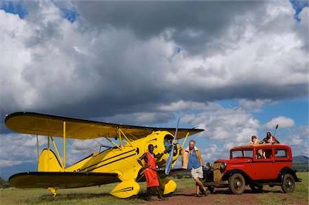 Kenya, Laikipia, Lewa Downs. Will Craig's 1930s style Waco Classic open cockpit bi-plane for the ultimate aerial safari. Foto de stock - Direito Controlado, Número: 862-03731582