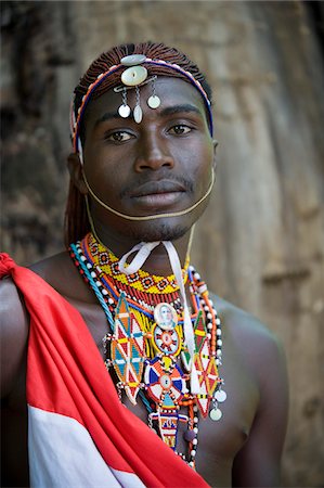 Kenya, Laikipia, Lewa Downs.  A Laikipiak Maasai warrior or moran in traditional dress. Foto de stock - Direito Controlado, Número: 862-03731609