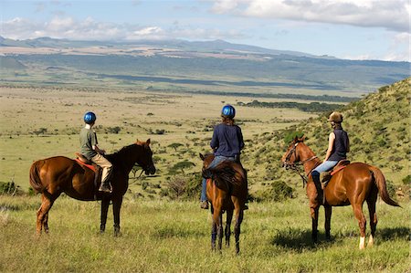 simsearch:862-03731582,k - Kenya, Laikipia, Lewa Downs. Horse riding during a family safari at Lewa Downs. Foto de stock - Con derechos protegidos, Código: 862-03731614