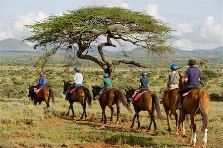 Kenya, Laikipia, Lewa Downs.  A family on a horse riding safari. Stock Photo - Rights-Managed, Code: 862-03731611