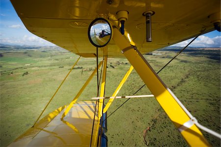 Kenya, Laikipia, Lewa Downs. Will Craig flies his 1930s style Waco Classic open cockpit bi-plane for ultimate aerial safaris. Stock Photo - Rights-Managed, Code: 862-03731624