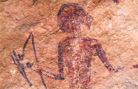 Libya, Fezzan, Jebel Akakus. A painted figure lies hidden on the walls of Graibu, one of Wadi Teshuinat's  caves Fotografie stock - Rights-Managed, Codice: 862-03731754