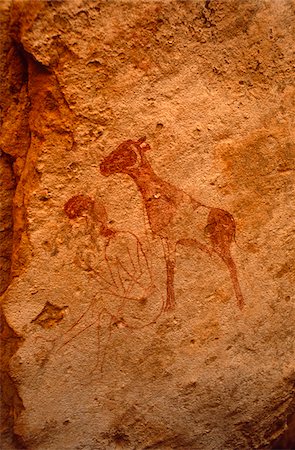 prehistoric - Libya, Fezzan, Jebel Akakus. Painted images on the walls of Uan Inehad (aka Infarden), one of Wadi Teshuinat's Stock Photo - Rights-Managed, Code: 862-03731759