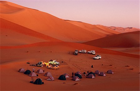 Libya, Fezzan, Edeyen Murzuk. Tourists set up camp amidst the dunes, within the vast 'sand sea' of the Edeyan Murzuk. Stock Photo - Rights-Managed, Code: 862-03731764