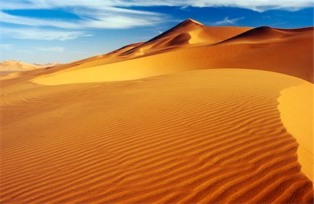 fezzan - Libya, Fezzan, Erg Uan Kasa. Seemingly endless dunes at Erg Uan Kasa, a 'sand sea' lying between Jebel Akakus and Messak Settafet. Stock Photo - Rights-Managed, Code: 862-03731760
