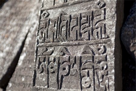 stone base - Nepal, Everest Region, Khumbu Valley. The Everest Base Camp Trek is marked by religous buddhist holy stones. Stock Photo - Rights-Managed, Code: 862-03731919