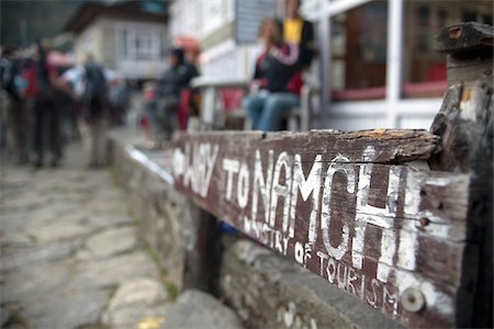 Nepal, Everest Region, Khumbu Valley. Teashops and trekkers line the walking track to Namche Bazaar on the Base Camp Trek Stock Photo - Rights-Managed, Code: 862-03731924