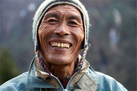 Nepal, Everest Region, Khumbu Valley.   The typical weathered smiling face of high altitude Sherpas Stock Photo - Rights-Managed, Code: 862-03731963