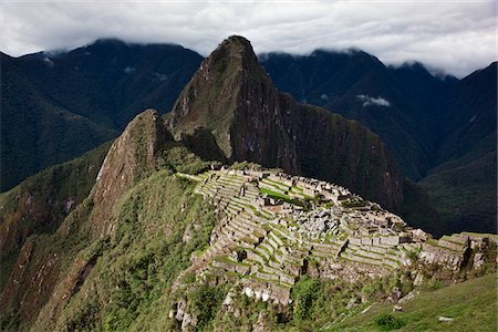 Peru, The world-famous Inca ruins at Machu Picchu at an altitude of 7,710 feet above sea level with the peak, Huayna Picchu. Stock Photo - Rights-Managed, Code: 862-03732063